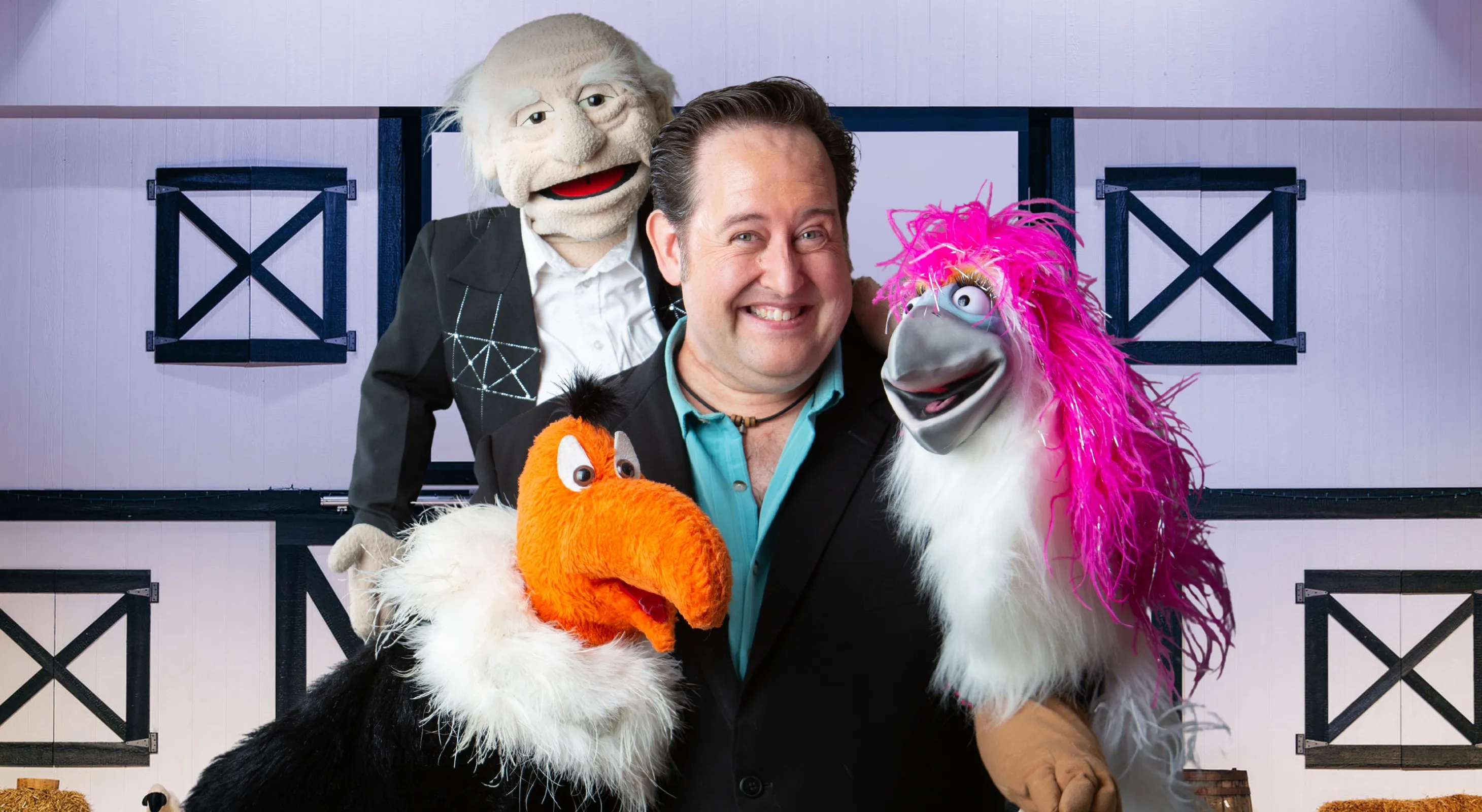 Ventriloquist with smiling dummy at Amish Country Theater